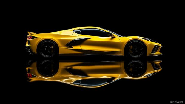 Black and Gold Car Wallpaper with a Chevrolet Corvette C8 in bright yellow, showcased under dramatic studio lighting.