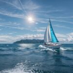 Captivating summer 1080p desktop Background of a sailboat gliding across a shimmering blue ocean on a sunny day.