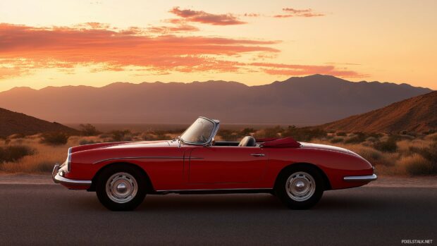 Car Desktop Wallpaper HD with a classic convertible driving through a desert road at sunset.