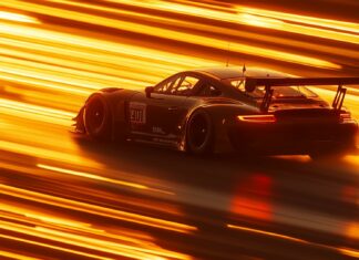 Car PC Wallpaper with a GT3 race car zooming down a straightaway at sunrise.