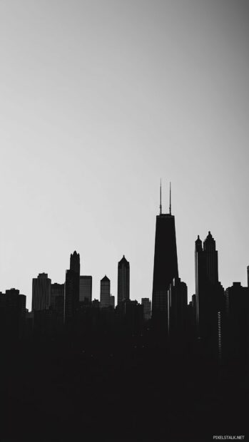 City iPhone wallpaper of the Chicago skyline with key landmarks like the Willis Tower in silhouette against a clear sky.