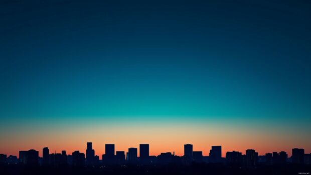 Cityscape at twilight, with subtle silhouettes of buildings and a gradient sky.