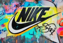 Classic Nike logo 4K on a bright, colorful graffiti wall background, with bold textures and street art detailing.