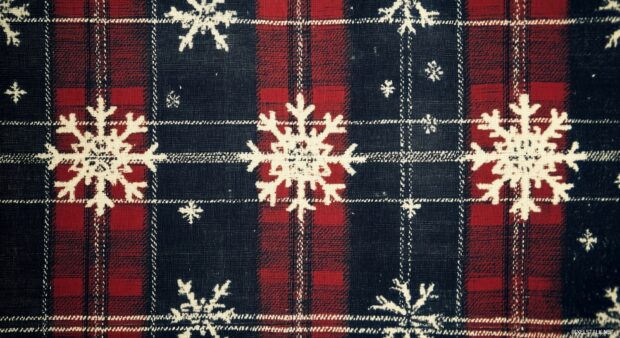 Classic preppy winter plaid pattern in navy, red, and white, featuring tiny snowflakes and mittens scattered throughout.