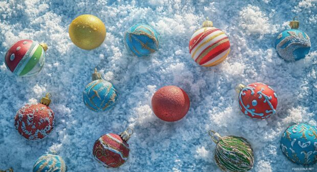 Colorful Christmas ornaments scattered across a soft snowy backdrop.