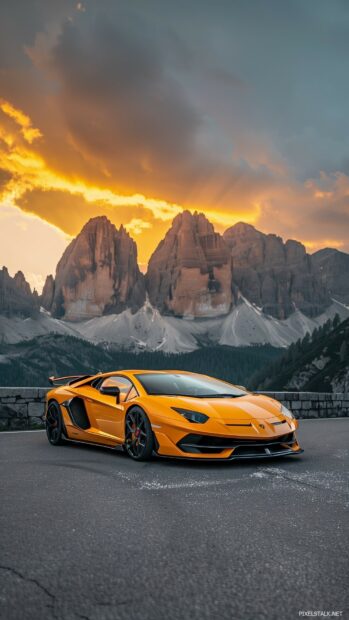 Cool car parked on a mountain road with a breathtaking sunset.