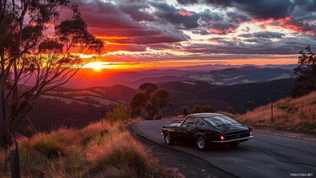 Cool car parked on a mountain road with a stunning sunset, Car HD 1080p desktop wallpaper.