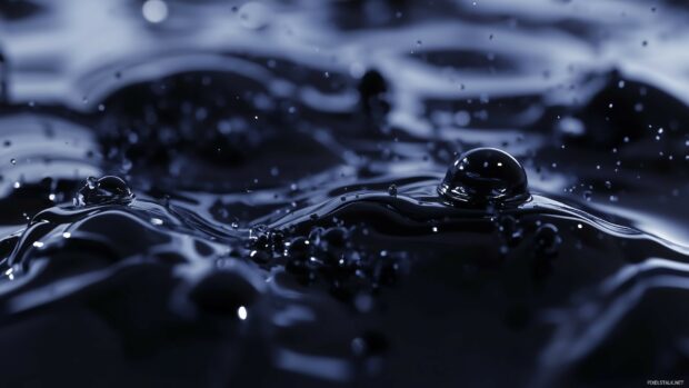 Elegant 3D liquid droplets falling in slow motion.