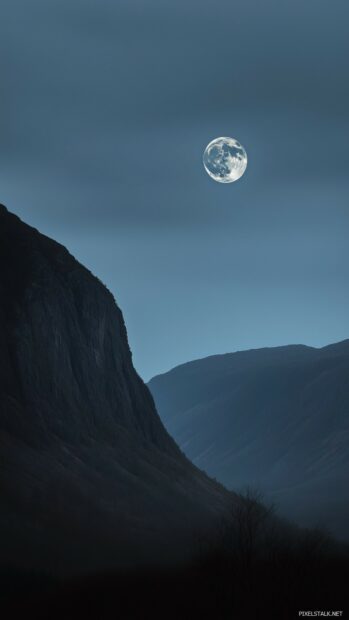 Elegant moonlight illuminating a simple mountain range, with soft gradient shading in the sky.