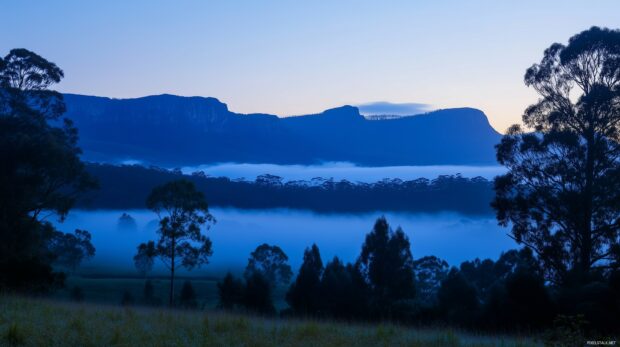 Fog rolling through deep blue Mountain valleys, beautiful wallpaper.