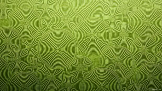 Green wallpaper 2K QHD featuring a gentle, concentric circle pattern.