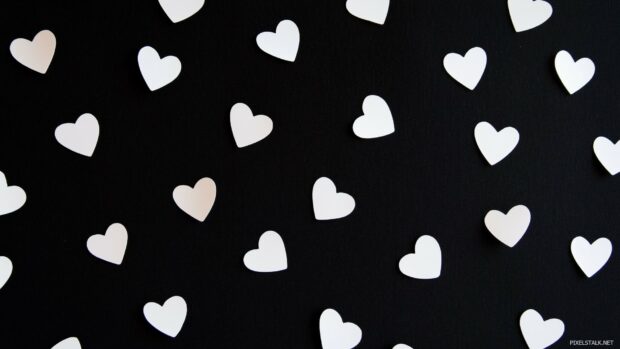 Heart Wallpaper with Scattered white heart shapes across a plain black background.