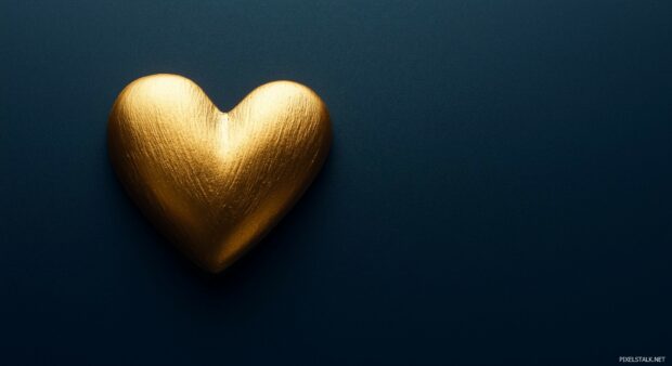 Heart Wallpaper with Small gold heart on a dark navy background with soft shadows.