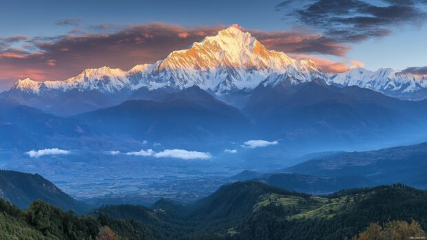 Majestic snow capped Mountains under a golden sunrise, surrounded by lush green valleys.