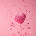 Minimal pink heart confetti over a soft gradient background, creating a cute Valentines theme.