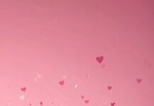 Minimal pink heart confetti over a soft gradient background, creating a cute Valentines theme.