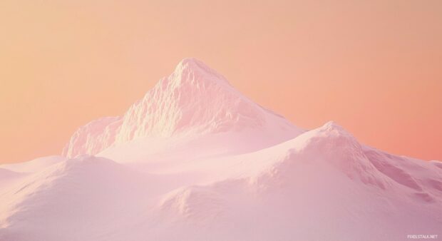 Mountain wallpaper with a snowy peak bathed in soft pink and orange hues of dawn, with rolling white slopes.