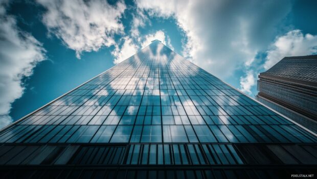 New York City HD Desktop Wallpaper with the Freedom Tower standing tall with the reflection of clouds in its glass.