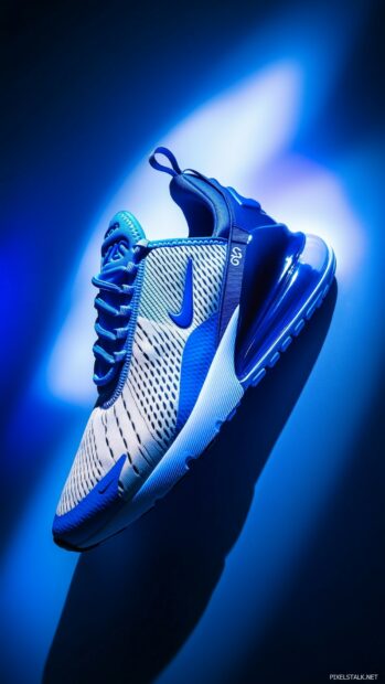 Nike Air Max70 shoes in a bold blue and white color scheme, showcased on a clean, minimalistic background with a subtle shadow effect.