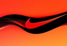 Nike Logo Wallpaper HD featuring the iconic swoosh in a bold, dynamic design with a gradient of red and black.