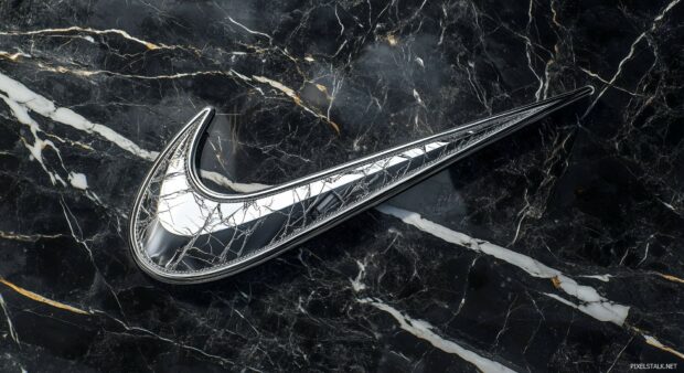 Nike Wallpaper HD features a swoosh logo in metallic silver against a dark marble texture.