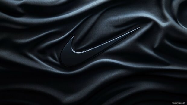 Nike background featuring a swoosh logo subtly embossed on a matte black surface.