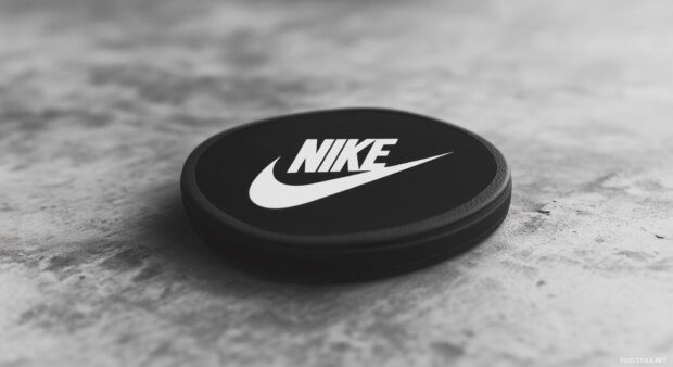 Nike logo 3D in black and white on a distressed concrete background.