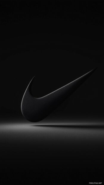 Nike logo in a minimalist design with a slight 3D effect on a deep black wallpaper.