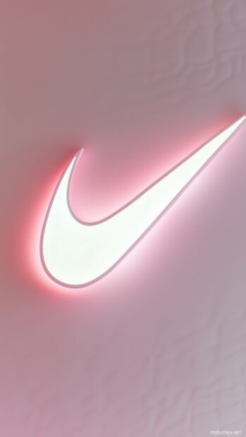 Nike logo with a soft glow effect on a pastel pink background.