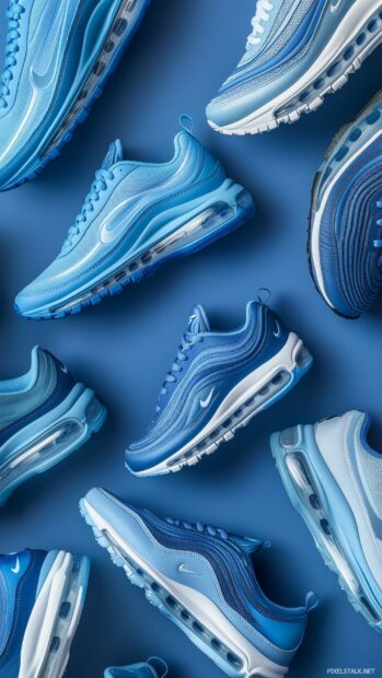 Nike sneakers in various shades of blue, arranged artistically against a deep blue backdrop.