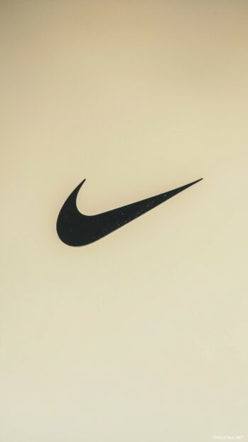 Nike wallpaper iPhone with Nike logo against a soft beige background.