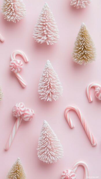 Pink Christmas Wallpaper with minimalist Christmas trees and candy canes in shades of light pink and gold.