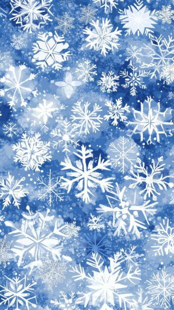 Preppy Christmas Wallpaper of cute snowflakes in various sizes and shapes, with soft shades of blue and white, creating a cozy winter vibes.