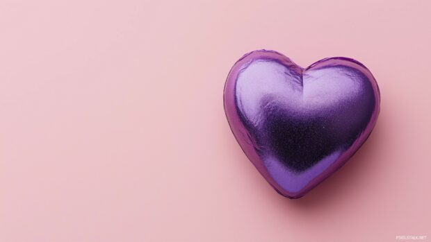 Purple heart against a muted pastel pink background.