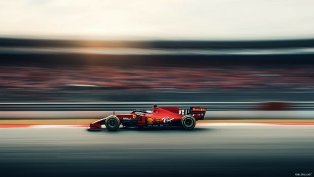 Race car wallpaper with a Formula 1 speeding through the final lap of a Grand Prix.