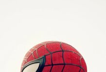 Side profile of Spiderman face with a plain white background.