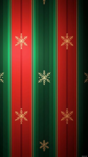 Simple Christmas wallpaper with a geometric pattern of simple red and green stripes with a delicate snowflake accent in each stripe.