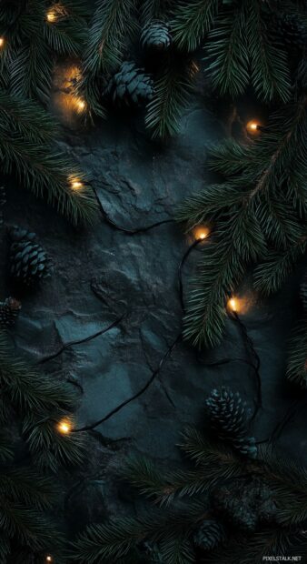 Simple Christmas wallpaper with a minimalist pine branch with delicate Christmas lights twinkling softly.