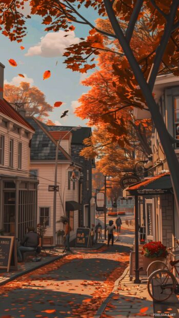 Small town in autumn, streets lined with trees in full fall colors.