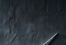 Stylish Nike wallpaper with a large metallic silver swoosh on a textured dark gray background.