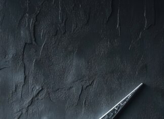 Stylish Nike wallpaper with a large metallic silver swoosh on a textured dark gray background.