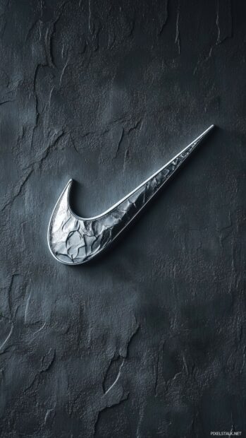 Stylish Nike wallpaper with a large metallic silver swoosh on a textured dark gray background.