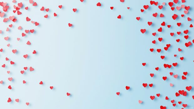 Tiny red hearts gently fading out on a light blue gradient background.