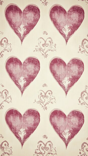 Valentine Day background with a repeating pattern of pink hearts with delicate swirls on a light beige background.