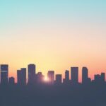 Widescreen 1080p Wallpaper with silhouette of a modern city skyline at sunset, soft gradient sky.