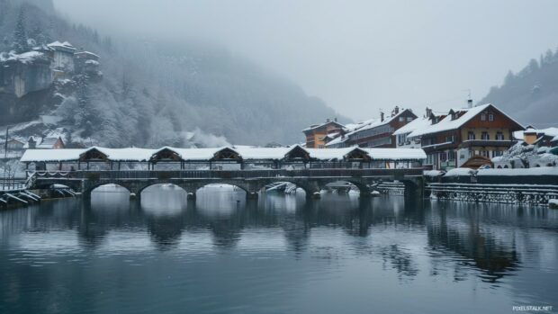 Winter computer wallpaper with snow covered bridge.