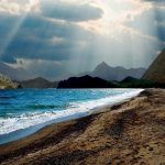 Sunbeams on a lovely sea cove beach hd wallpaper 1920x1200.