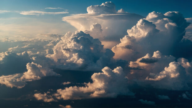 Dramatic summer sky wallpaper with bold colors and striking cloud formations.