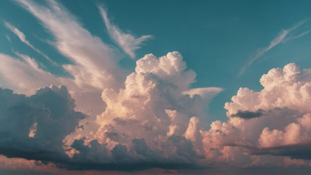Serene summer sky wallpaper with soft pastel colors and a gentle breeze.
